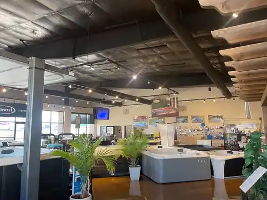 Hot tubs and potted plants arranged in the Columbia showroom