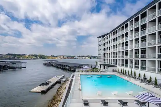 Wide view of the same resort pool with docks beyond
