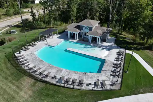 Aerial view of a clubhouse neighborhood pool