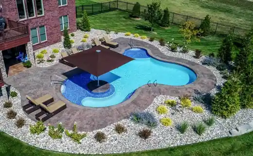 Freeform pool with swim-up shade