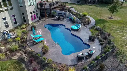 Aerial view of a freeform pool with loungers