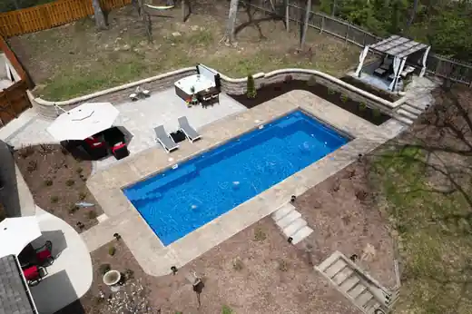 Aerial view of a pool in a terraced yard
